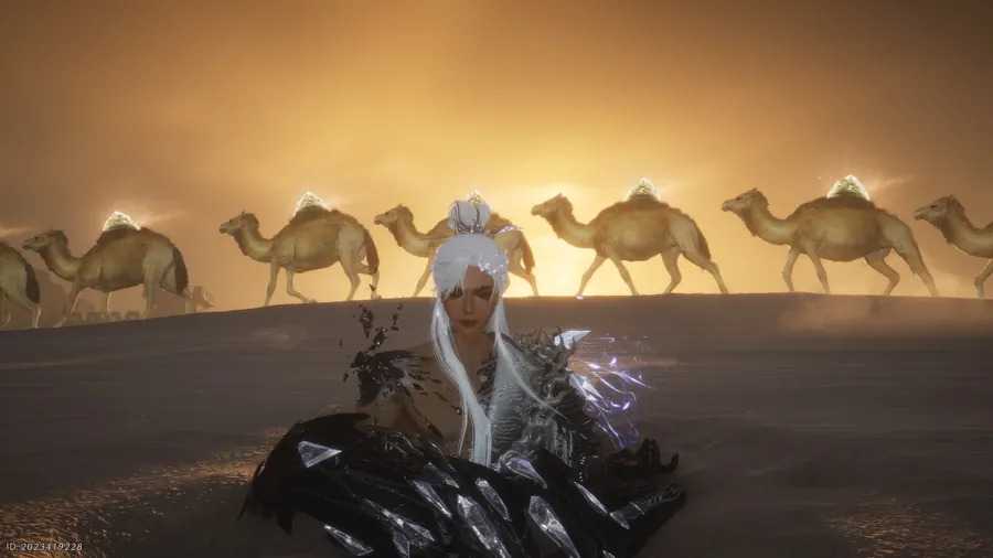 Seated figure in the desert with camels walking behind.