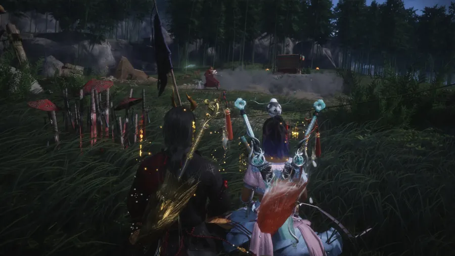 Several guild members seated together in a grassy area.